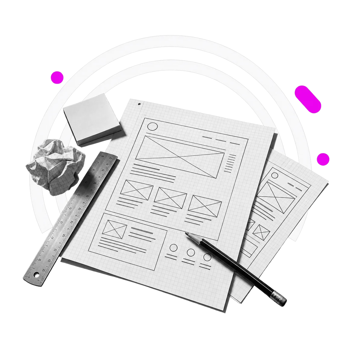 Tavolo con wireframe disegnati a mano su carta a griglia, righello e matita